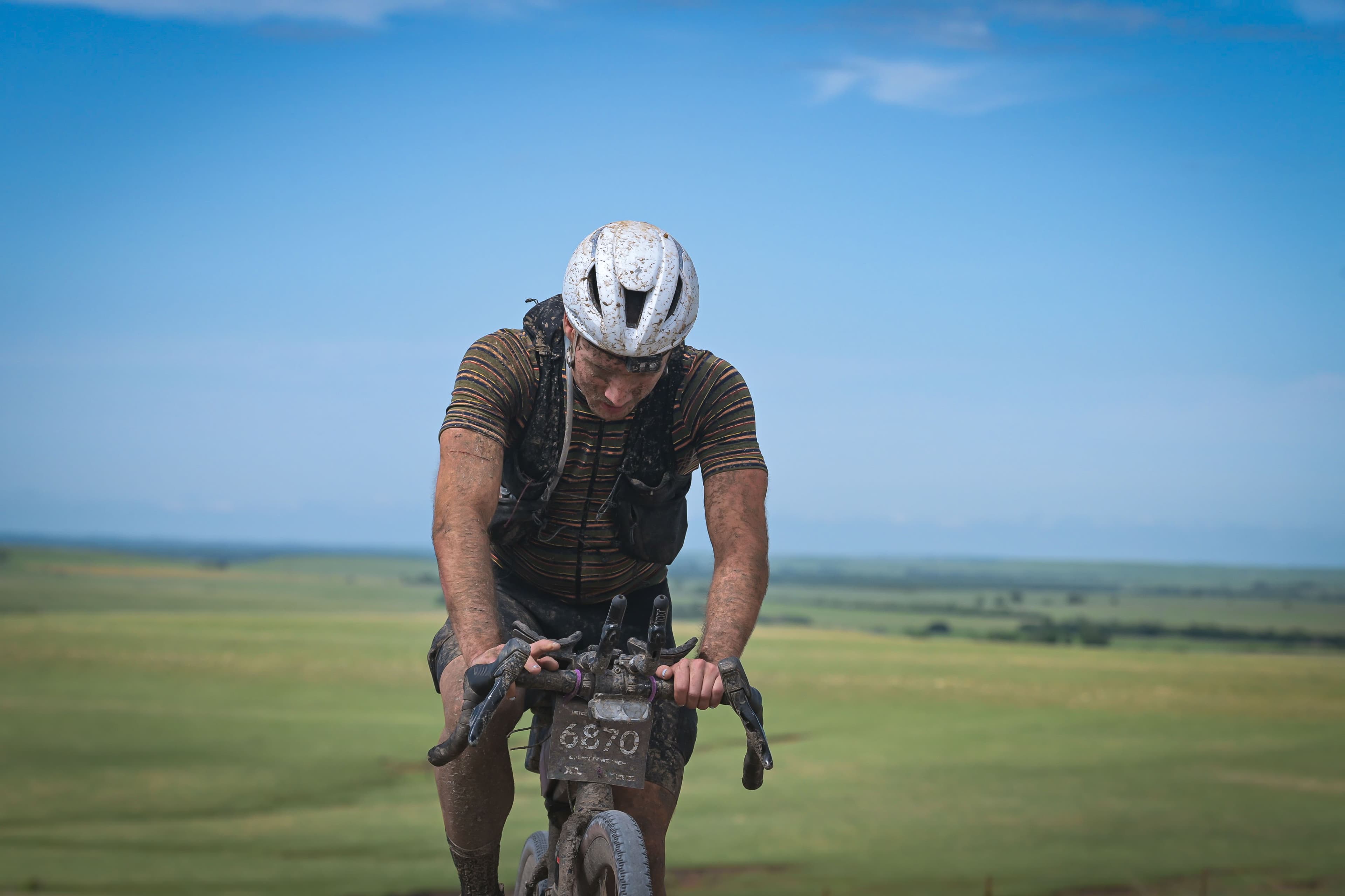 Mud-caked and grinding through the Flint Hills as the sun comes up