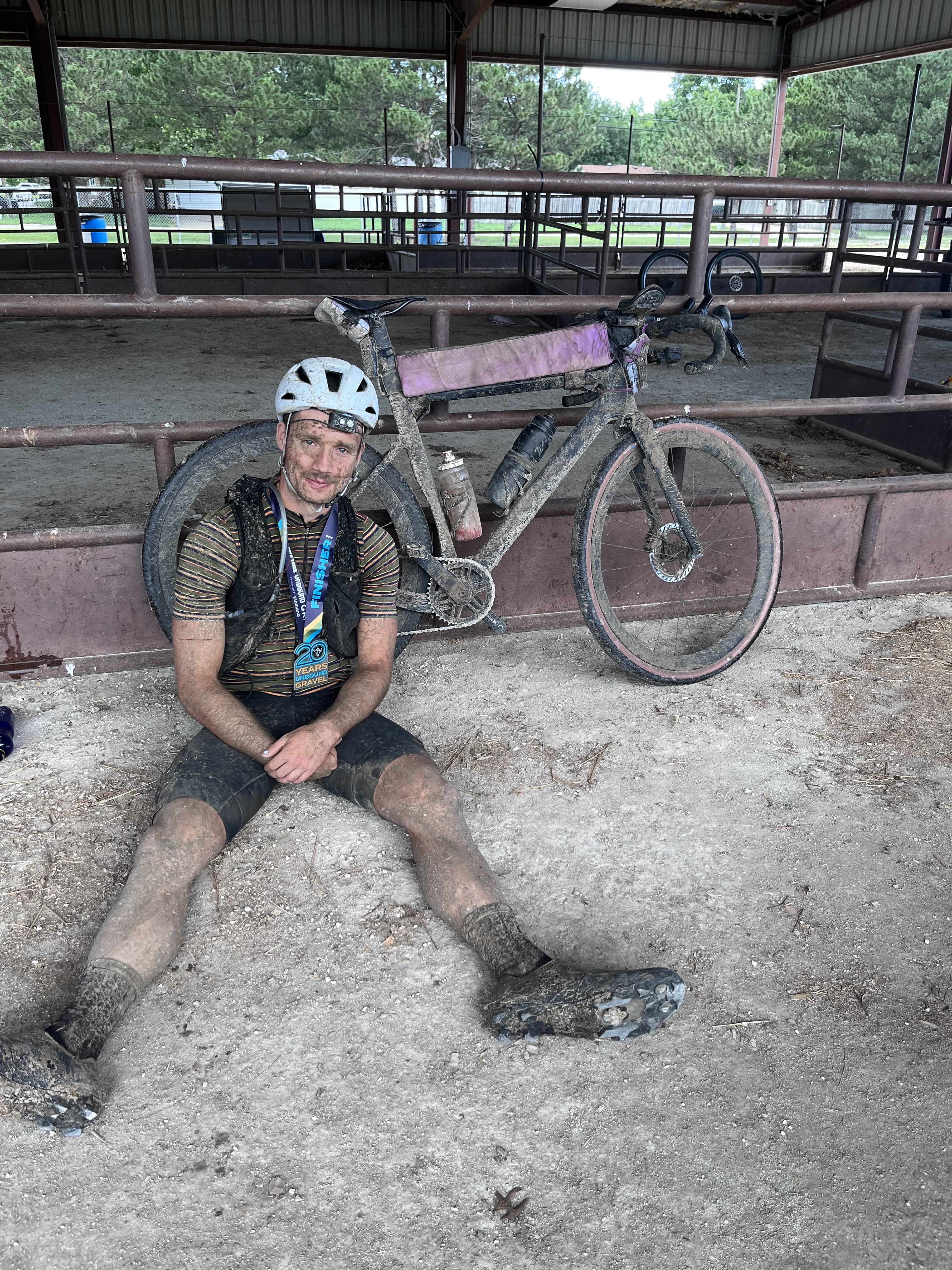 Sitting in the dirt with the finisher medal, done